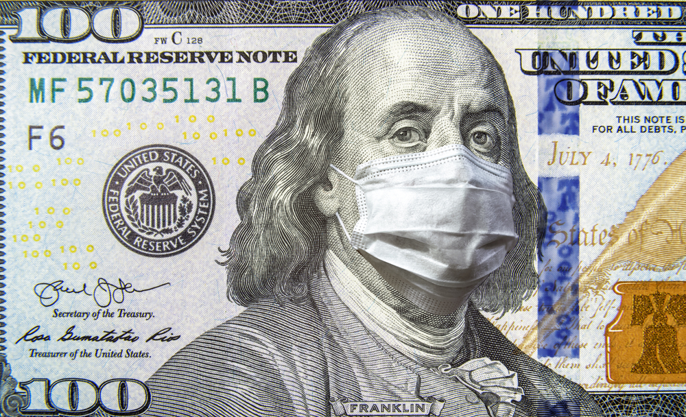 close up of a $100 bill with a face mask on Ben